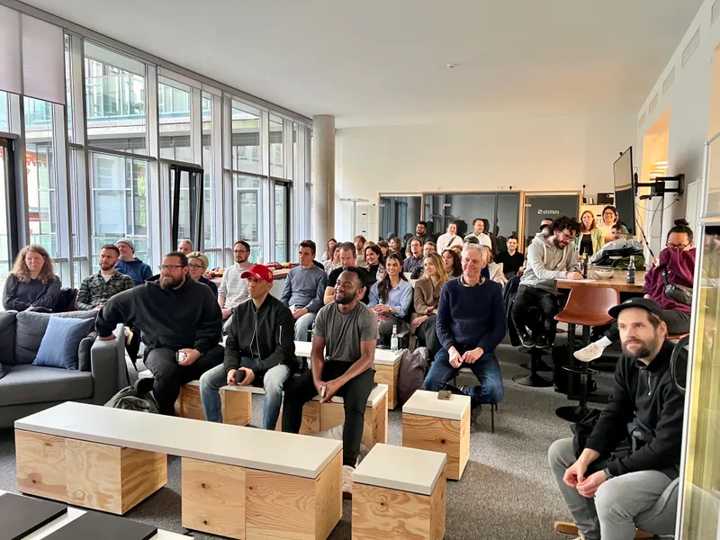 People listening to a talk at Dev & Design Meetup 6